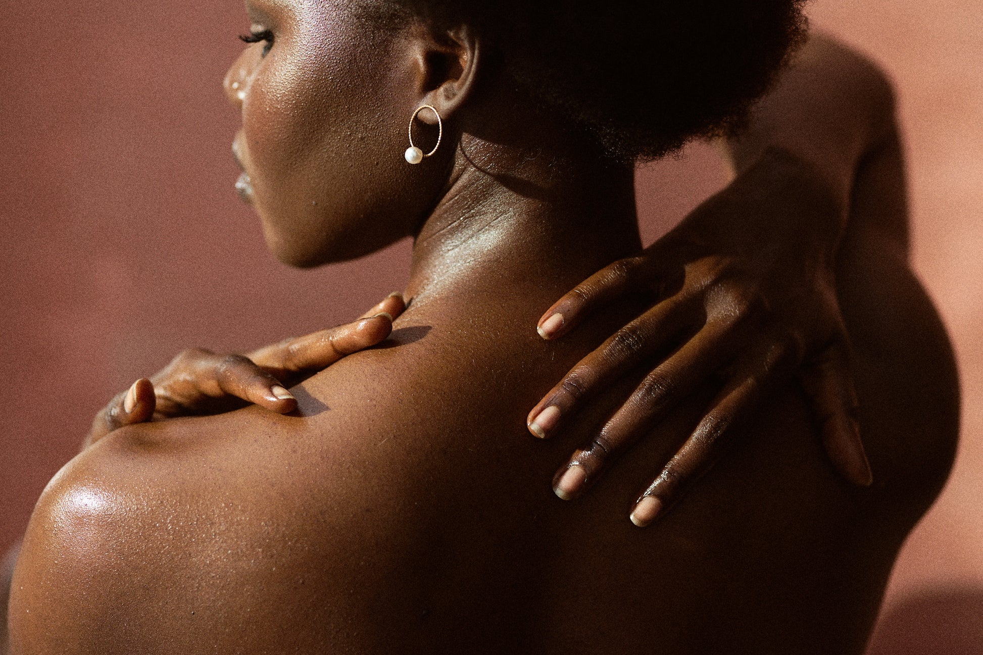 Madoni Shea Butter Soap Back and hands of African woman